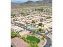 Aerial view of the community showcases lush landscaping, a community pool and convenient access to highways at 4918 W Wahalla Ln, Glendale, AZ 85308