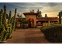 Stunning exterior with landscaped walkway, desert foliage, tile roof, and cozy, inviting entry at 6043 E Hearn Rd, Scottsdale, AZ 85254