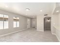 Bright and airy living room with neutral paint, tile flooring, and recessed lighting at 619 E Jensen St # 14, Mesa, AZ 85203