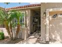 Close up of the front entrance featuring gated access and a well-maintained yard at 6611 N 79Th Pl, Scottsdale, AZ 85250
