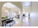 Bright and airy living space featuring tile floors and a fireplace with an open-concept layout at 6611 N 79Th Pl, Scottsdale, AZ 85250