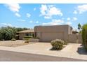 Attractive home featuring desert landscaping, a two-car garage, and a well-maintained lawn at 6717 E Aire Libre Ln, Scottsdale, AZ 85254