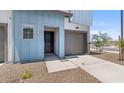 Charming townhome featuring a private garage and a contemporary architectural style at 7428 S 75Th Ln, Laveen, AZ 85339