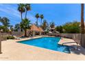 Community pool area offers a refreshing swimming space, ample seating, and shade for relaxation at 7716 S Rita Ln, Tempe, AZ 85284