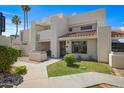 Inviting two-story home with a well-manicured lawn, front patio, and desert landscaping at 848 E Morningside Dr, Phoenix, AZ 85022