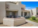 Inviting two-story home with a well-manicured lawn and front patio with outdoor seating at 848 E Morningside Dr, Phoenix, AZ 85022