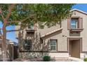 Inviting two-story home with a well-maintained exterior and desert landscaping at 1255 S Rialto -- # 115, Mesa, AZ 85209
