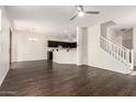 Spacious open-plan living area featuring hardwood floors and seamless flow to the kitchen at 1255 S Rialto -- # 115, Mesa, AZ 85209