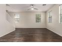 Modern living space with wood floors, neutral walls, and large windows for ample light at 1255 S Rialto -- # 115, Mesa, AZ 85209