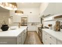 Well-lit kitchen with an island, marble countertops, state-of-the-art appliances, and a breakfast bar at 12776 N 78Th St, Scottsdale, AZ 85260