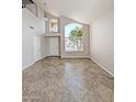 Bright living room with a large window and tile floors at 1332 E Charleston Ave, Phoenix, AZ 85022