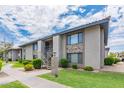 Inviting apartment complex with well-manicured lawns and walkways under a bright, cloudy sky at 1402 E Guadalupe Rd # 207, Tempe, AZ 85283