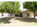 Charming single-story home with mature trees and a well-maintained lawn at 1412 W 7Th Pl, Tempe, AZ 85281