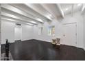 Expansive living room featuring dark floors and bright, natural light at 1613 W Flower N Cir, Phoenix, AZ 85015
