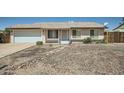 Charming single-story home with desert landscaping and two car garage at 17232 N 29Th Ave, Phoenix, AZ 85053