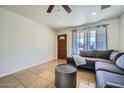 Inviting living room with tile flooring, ceiling fan and ample natural light at 17232 N 29Th Ave, Phoenix, AZ 85053