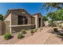 Charming single-story home with stucco exterior and well-maintained landscaping around the foundation at 1849 S Balboa Dr, Gilbert, AZ 85295