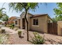 Single-story home featuring a tiled roof, neutral stucco, and desert landscaping at 1849 S Balboa Dr, Gilbert, AZ 85295