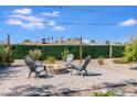 Cozy backyard fire pit with comfortable seating, ideal for relaxing evenings under the stars at 1930 W Missouri Ave, Phoenix, AZ 85015