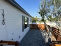 This home features a private outdoor space with a paver patio and modern wood accents at 1930 W Missouri Ave, Phoenix, AZ 85015
