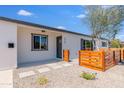Inviting home exterior showcasing a modern entrance and xeriscaped front yard for low maintenance at 1930 W Missouri Ave, Phoenix, AZ 85015