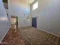Bright, open living room with high ceilings and abundant natural light at 25748 W Siesta Way, Buckeye, AZ 85326