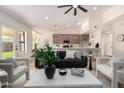Open-concept living room with a view into the kitchen and neutral contemporary design at 2716 N Kristen --, Mesa, AZ 85213