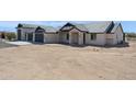 Wide angle of a single Gathering home featuring a tiled roof, three-car garage, and desert landscaping at 31652 N Misty Ln, Queen Creek, AZ 85142