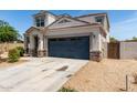 Lovely two-story house with an attached two-car garage and low maintenance landscaping at 42098 W Balsa Dr, Maricopa, AZ 85138