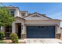 Beautiful home showcasing a two-car garage, stucco siding, and desert landscaping at 42098 W Balsa Dr, Maricopa, AZ 85138