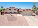 Charming two-story home with a well-manicured yard, fountain, and an attached two-car garage at 4414 S Ventura Dr, Tempe, AZ 85282