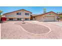 Charming two-story home with a well-manicured yard, fountain, and an attached two-car garage at 4414 S Ventura Dr, Tempe, AZ 85282