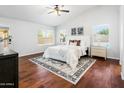 Spacious main bedroom features wood floors, ceiling fan and abundant natural light at 4684 W Tyson St, Chandler, AZ 85226