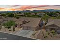 Charming single-story home featuring a desert landscape, three-car garage, and breathtaking mountain views at 5332 E Thunder Hawk Rd, Cave Creek, AZ 85331