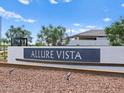 Allure Vista community entrance sign with desert landscaping and blue sky backdrop at 5464 S 246Th Ln, Buckeye, AZ 85326