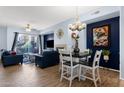 Open-concept living area featuring hardwood floors, modern furniture, and ample natural light at 6745 N 93Rd Ave # 1158, Glendale, AZ 85305