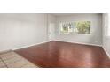 Sunlit room with new flooring, large window, and neutral paint at 725 S Power Rd # 101, Mesa, AZ 85206