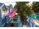 Charming townhomes overlook a community pool, surrounded by lush greenery at 860 N Mcqueen Rd # 1151, Chandler, AZ 85225