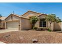 Exterior showcasing a well-maintained single-Gathering home, desert landscaping, and charming curb appeal at 11518 W Dana Ln, Avondale, AZ 85392