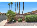 Santos Court community entrance sign with lush landscaping and clear blue skies at 13224 N 98Th Ave # L, Sun City, AZ 85351