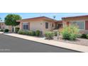 Cozy single-story home with well-maintained landscaping and a charming entryway at 13224 N 98Th Ave # L, Sun City, AZ 85351