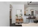 Bright living space with modern décor and easy access to the kitchen area and other parts of the home at 1411 E Orangewood Ave # 237, Phoenix, AZ 85020