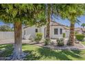 Attractive single-story home featuring lush landscaping and a beautiful desert-style front yard at 1444 E Boston St, Chandler, AZ 85225