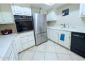 Well-lit kitchen featuring stainless steel appliances and ample counter space at 17404 N 99Th Ave # 126, Sun City, AZ 85373