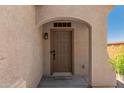 Close-up of a welcoming front door with a covered entryway, showcasing the home's inviting and well-maintained exterior at 17649 W Buchanan St, Goodyear, AZ 85338