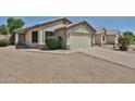 Charming single-story home featuring a two-car garage, low maintenance desert landscaping, and a neutral color palette at 21833 N 34Th Ave, Phoenix, AZ 85027