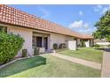 Inviting single-story home showcasing desert landscaping, red tile roof, and a private front yard at 25 N Cottonwood St # 47, Chandler, AZ 85225
