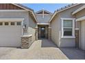 Inviting home exterior with a well-maintained facade, brick accents, and a beautifully paved walkway to the front door at 2514 E Pleasant Ln, Phoenix, AZ 85042