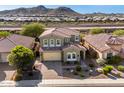 Beautiful two-story home with a red tile roof, a two-car garage, and a professionally landscaped front yard at 32096 N 132Nd Dr, Peoria, AZ 85383