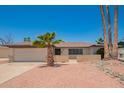 Charming single-story home featuring mature palm trees, low brick facade, and a two car garage at 3620 S Terrace Rd, Tempe, AZ 85282